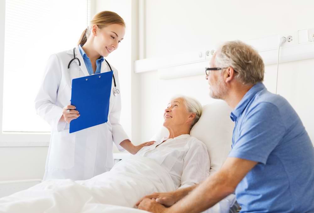 Eye doctor talking with Canberra patient.